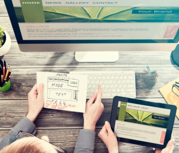 Designer's desk with responsive web design concept.