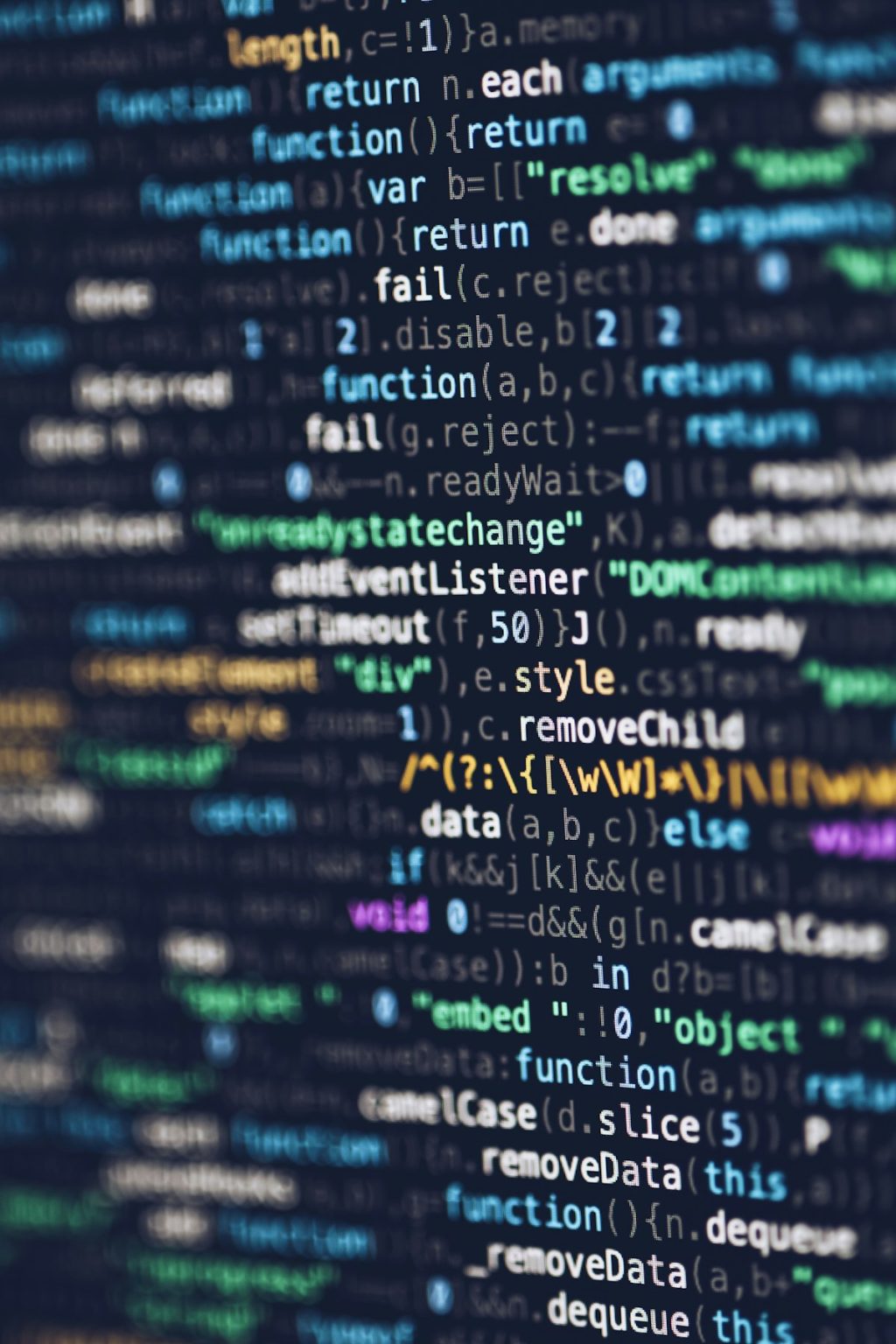 HTML CSS JavaScript source code displayed on a monitor representing CSS layout code